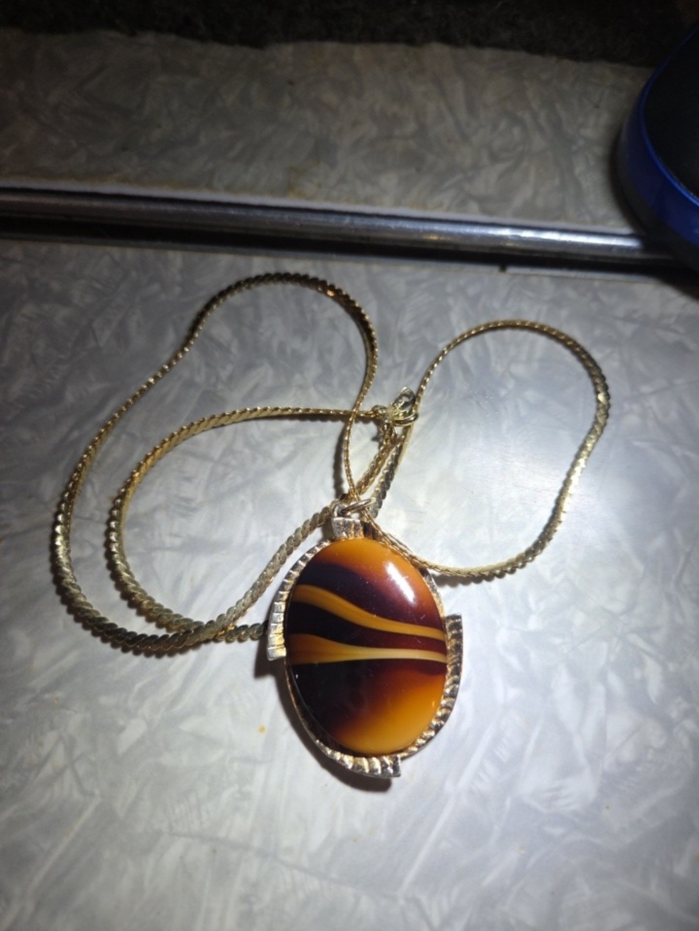 Gold-Tone Necklace with Brown and Yellow Striped Oval Pendant